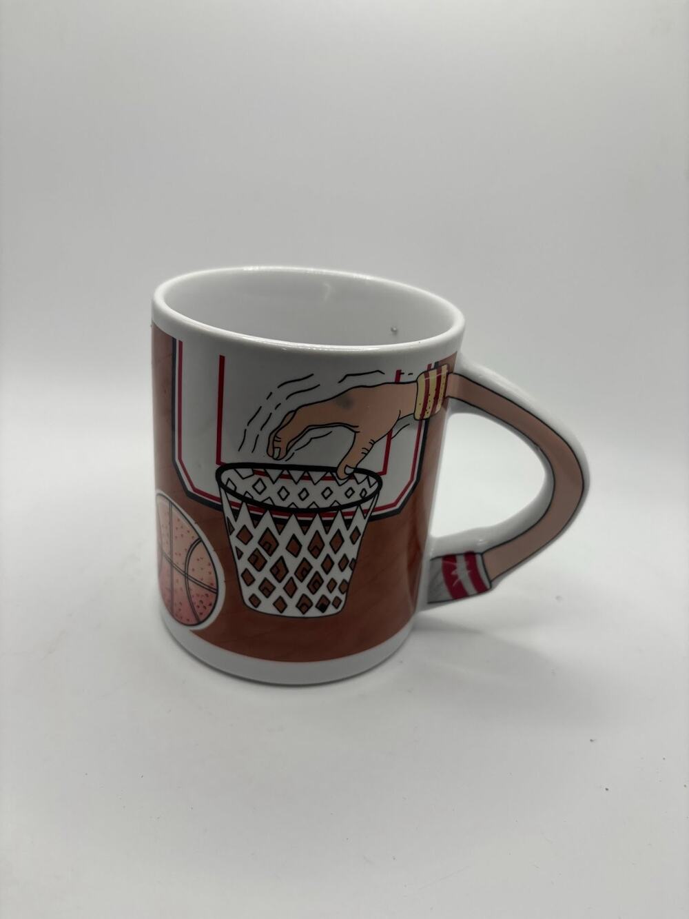 Very Unique Basketball Coffee Mug handle is the arm dunking basketball